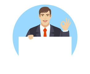 OK! Businessman holding white blank poster and showing a okay hand sign