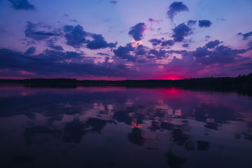 Fototapeta na wymiar Beautiful landscape with the sunset on the Urals lake