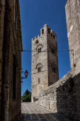 Fototapeta na wymiar ERICE, SICILY, ITALY - JULY 10, 2017 - Erice is a wonderfully preserved Mediaeval town offering the most breathtaking views and a palpable sense of history. Matrice church.