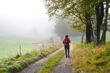 Fototapeta premium Woman hiking in the forest