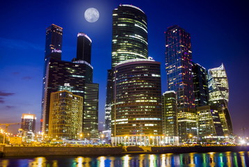Fototapeta na wymiar Night view of Moscow city with full moon. Moscow, Russia.