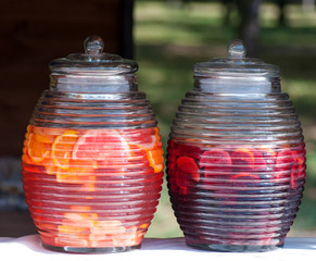 Fruit drink from oranges in large jars