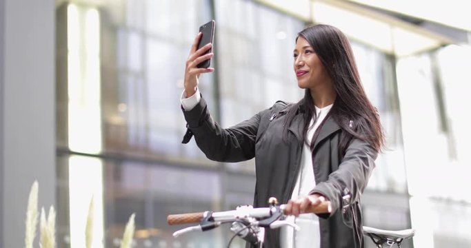 Female cyclist taking a selfie 