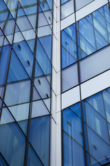 Abstract building background. Crystal facade with reflections.