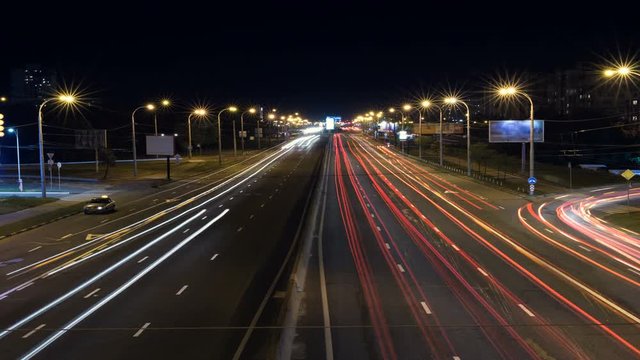 Car trails and city traffic at evening time.