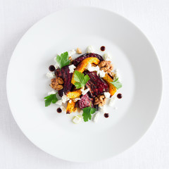 bright autumn salad of roasted vegetables with cheese and nuts