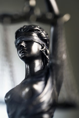 Fototapeta na wymiar Legal office of lawyer. legal model statue of Themis goddess of justice.