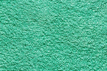 Green color bath cotton towel texture. Background and texture.