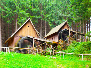 Gold ore mills. Medieval wooden water mills in Zlate Hory, Czech Republic.