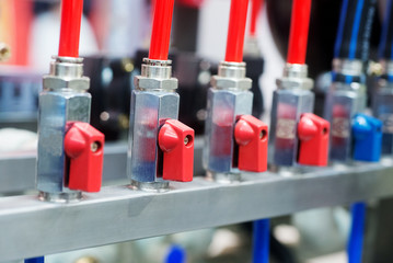 Naklejka premium Connecting system with hose and valve. Auto industrial background