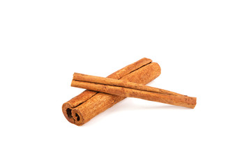 Two cinnamon sticks on a white background