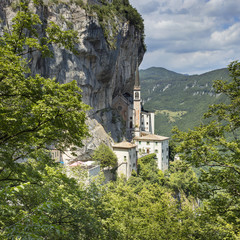 old catholic church under mountain in Italy