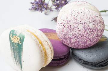 colorful macaroon cakes  against white background