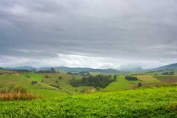 Summertime rural landscape against the background of mountains Western Carpathians, Zilina Region in the Slovakia