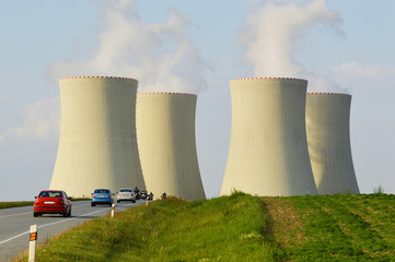 nuclear power plant, cooling towers with road and cars