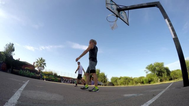 Sky hook shot in a one on one basketball game