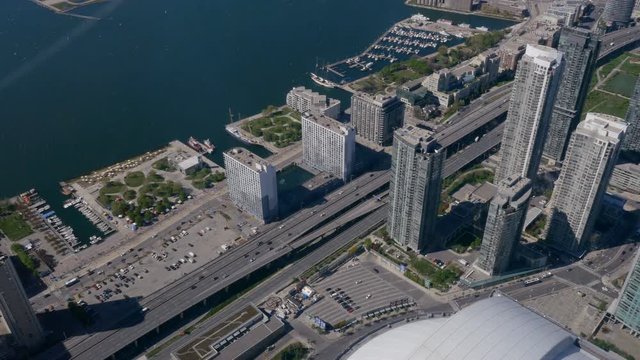 Lakeshore Boulevard and the Gardiner Expressway filmed from a hight with Lake Ontario's waters visible. Overhead.