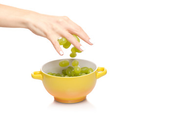Female hands with grape bunches plate