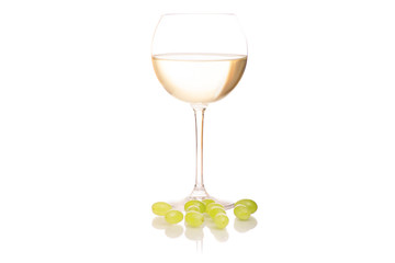 White wine in a glass of grapes