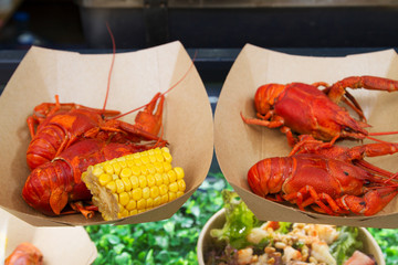 Crayfish or crawfish being served on food stall on open kitchen international food festival event of street food