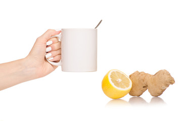 Female hand holding lemon ginger tea
