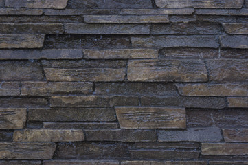 Stone surface covered with a thin sheet of water