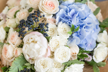 Rich bunch of peonies, roses and hydrangea flowers, green leaf. Fresh spring bouquet. Summer Background. Selective focus.