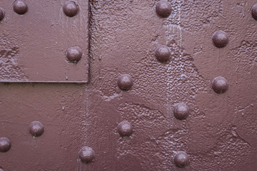 Closeup of red rivets