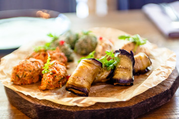 Traditional Georgian cuisine snacks - rolls of eggplant and 