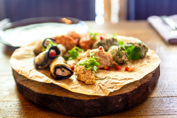 Traditional Georgian cuisine snacks - rolls of eggplant and 