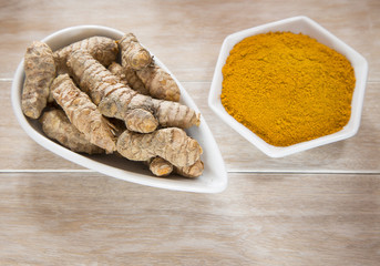 Roots and turmeric powder - Curcuma longa