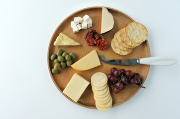 Flat lay view of cheese  platter with red wine