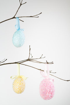 Decorated Easter Eggs Hanging From Branch