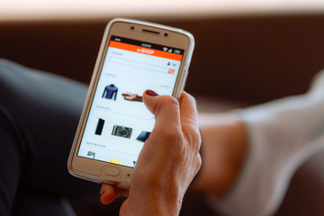 Close-up of woman hand operating in an e-shop