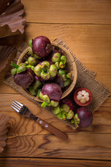 Mangosteen fruit on wood table