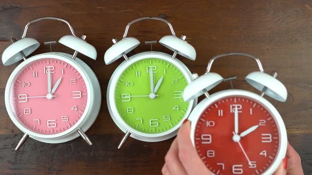 4k Turning the clocks back one hour for Autumn Fall daylight saving time.