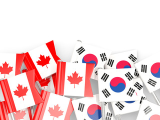 Flag pins of Canada and South Korea isolated on white