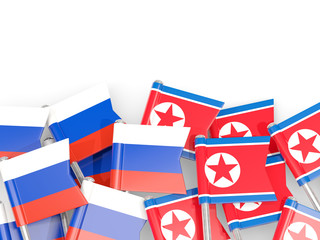 Fototapeta na wymiar Flag pins of Russia and North Korea isolated on white