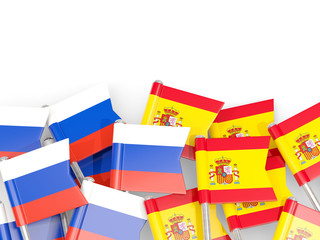 Flag pins of Russia and Spain isolated on white