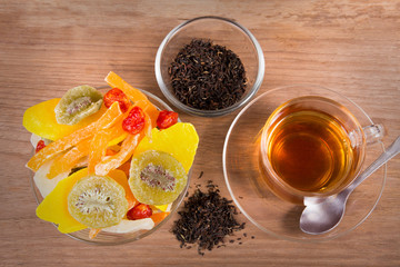 tea and dried fruits on wooden table