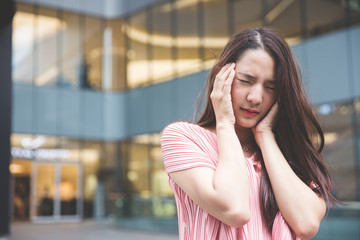 Young asian lady get headache