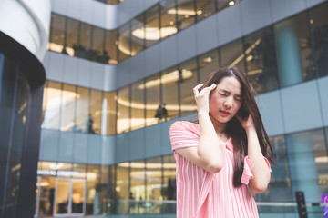 Young asian lady get headaches