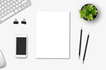 Top view of blank paper page on wood background office desk and different objects. Minimal flat lay style