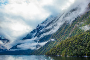 white cloud and high mountain in milford sound fiord land national park new zealand most popular traveling destinaton