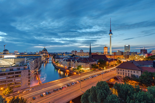 Downtown Berlin with the famous Television Tower and the Spree river at night