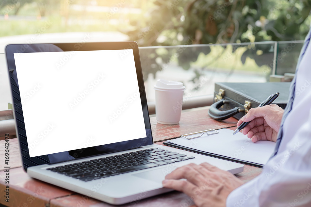 Poster Image of businessman working with laptop, tablet and financial document data graph on table in outdoor office, finance,investment, business concept