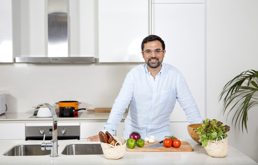 Fototapeta na wymiar arab man preparing food in his urban apartment