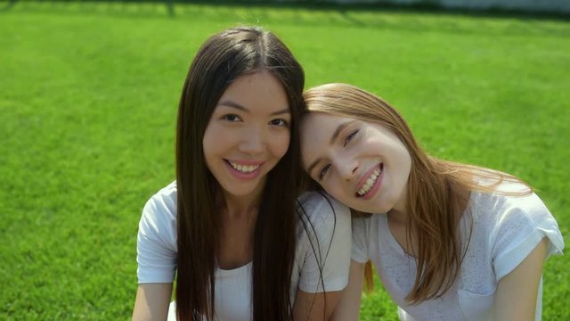 Close up of dreaming girls having a rest against nature background