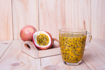 Passion fruits on wooden background.  as package design element