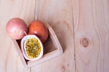 Passion fruits on wooden background.  as package design element
